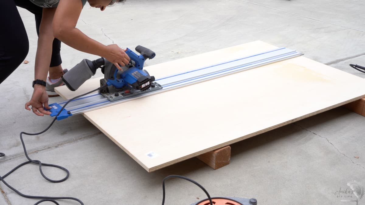 cutting down the plywood using a circular saw for the wooden laundry room countertop