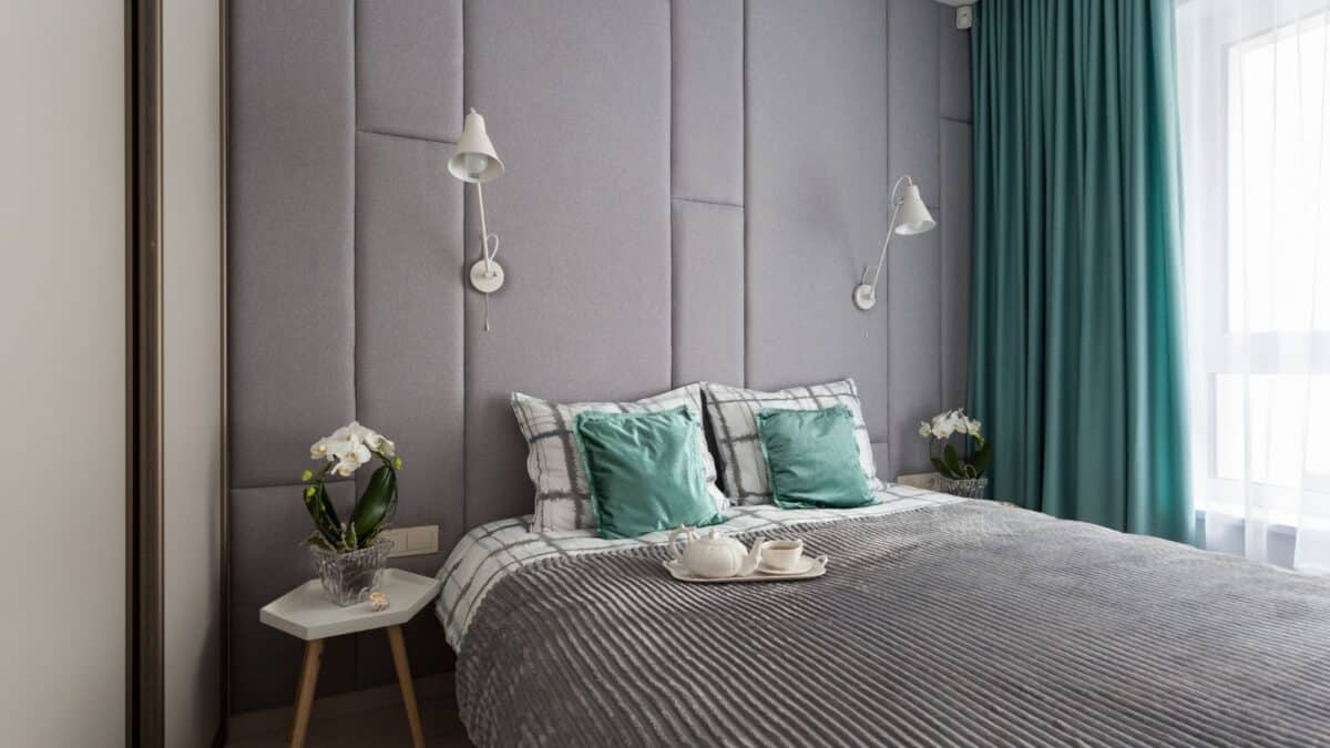 Gray fabric paneled wall in a bedroom