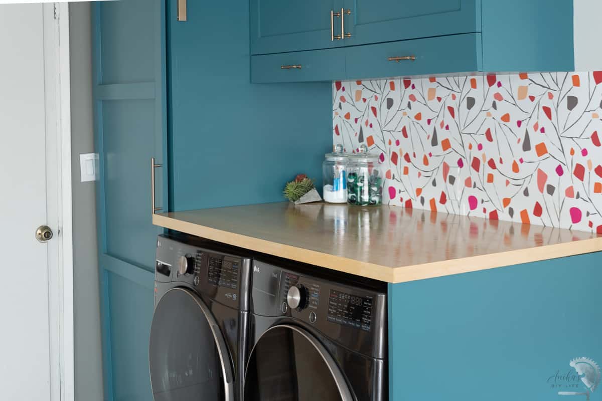 Plywood countertop in blue laundry room