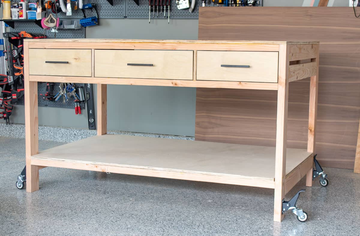 Wooden workbench with drawers and storage in workshop