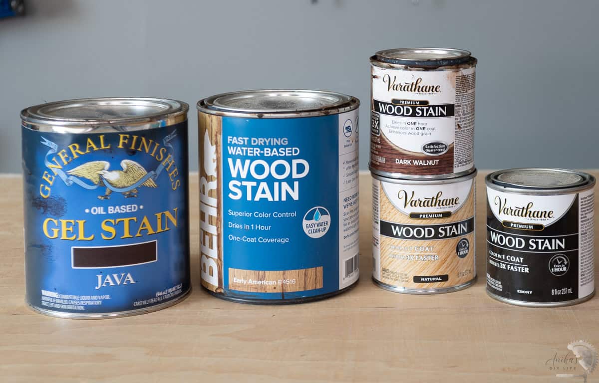 Multiple types of stain cans on workbench
