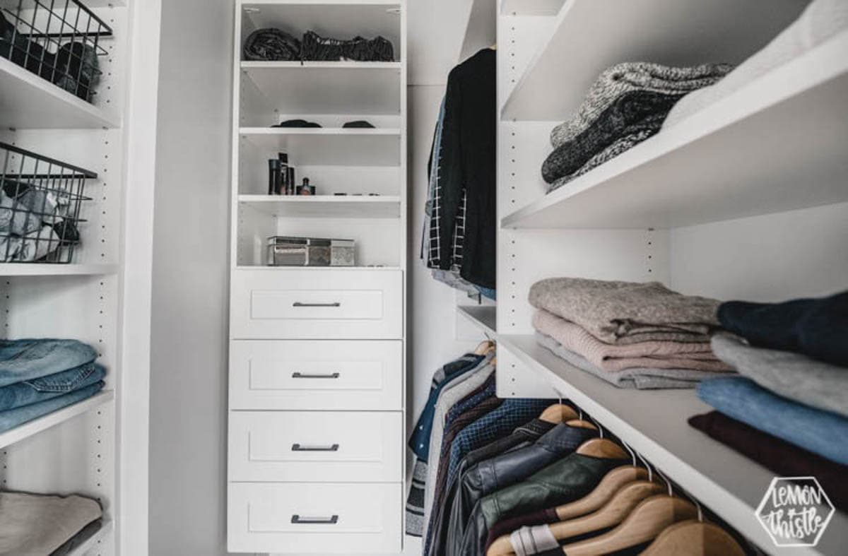 Master closet with shelves and drawers
