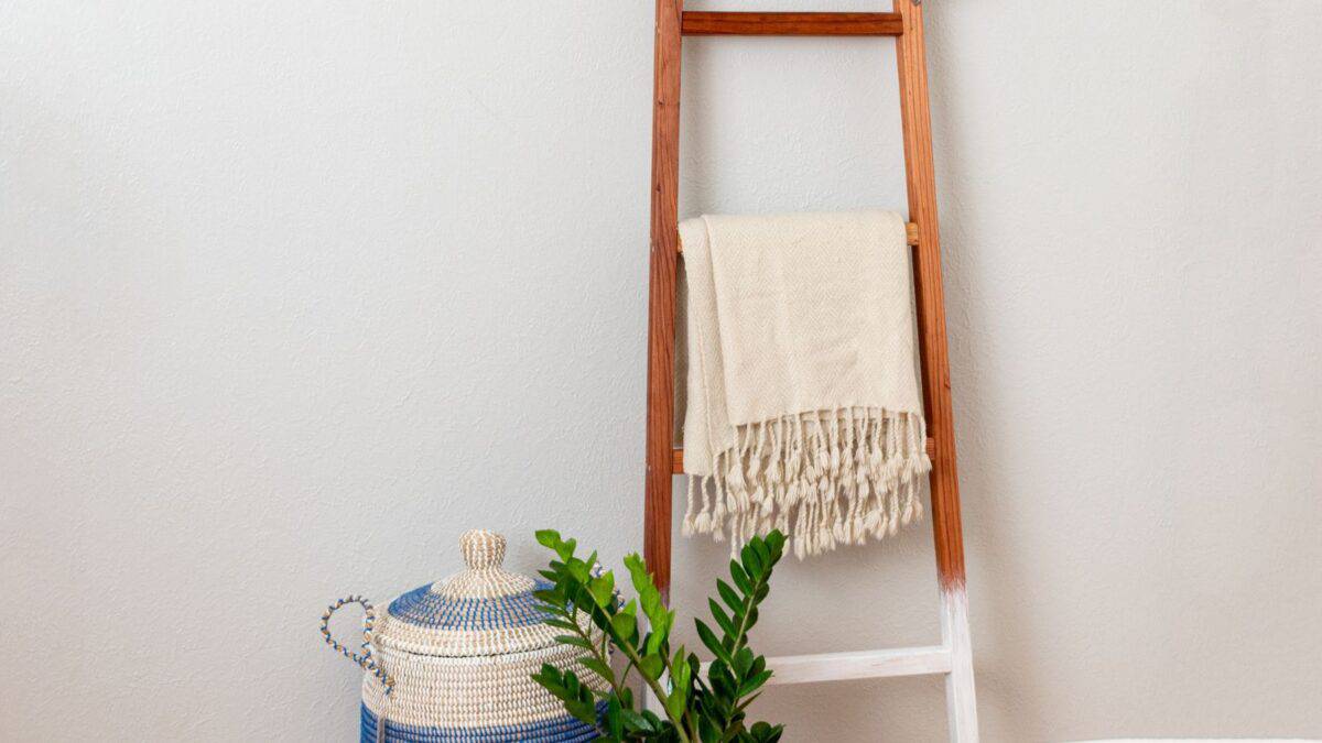 DIY blanket ladder with white painted legs