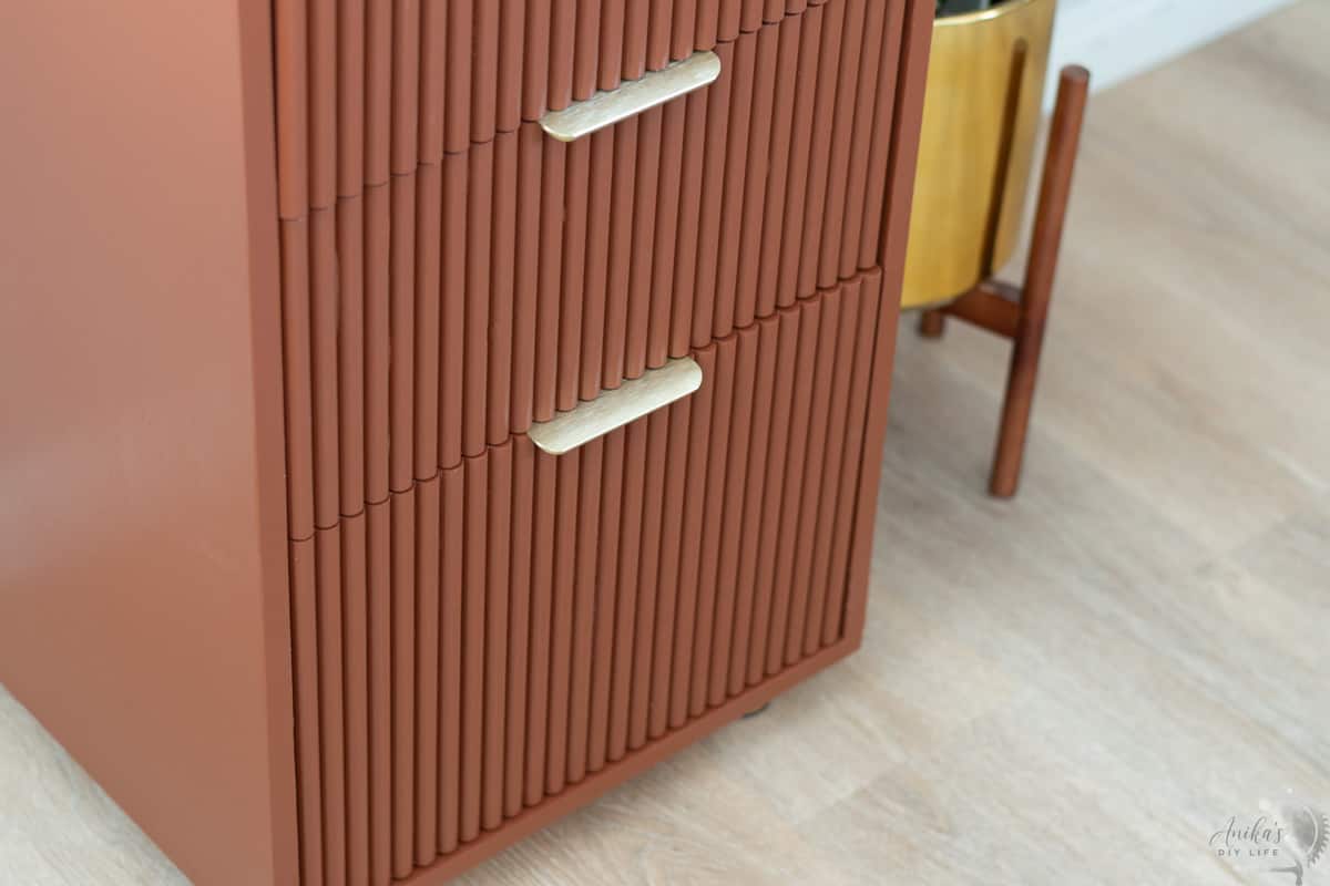 Close up of the fluted drawer fronts of the file cabinet