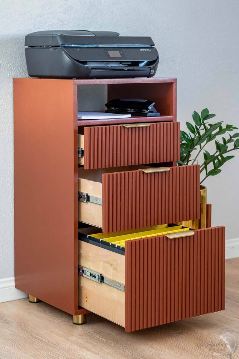 Terracotta colored wood DIY File Cabinet with. the drawers open.