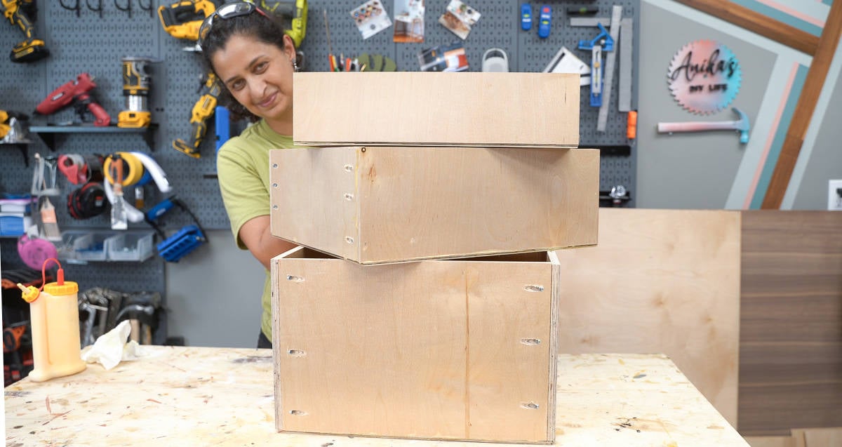 woman with three drawers built for a DIY file cabinet