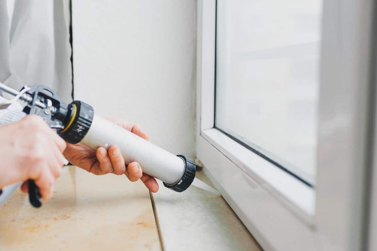applying new caulking fall home maintenance task