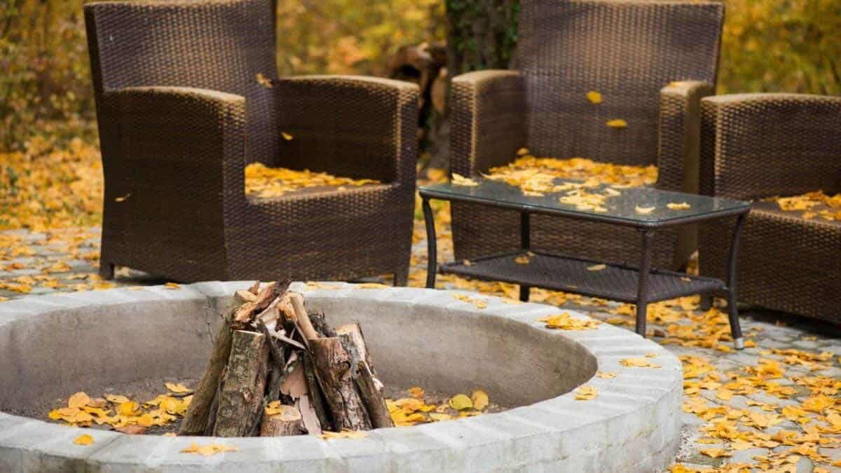 outdoor furniture around a fire pit in the fall