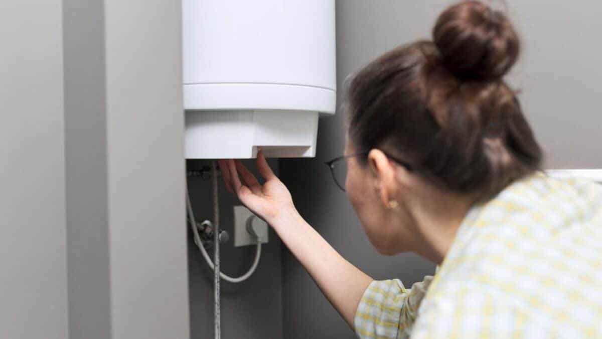 Woman draining a hot water heater