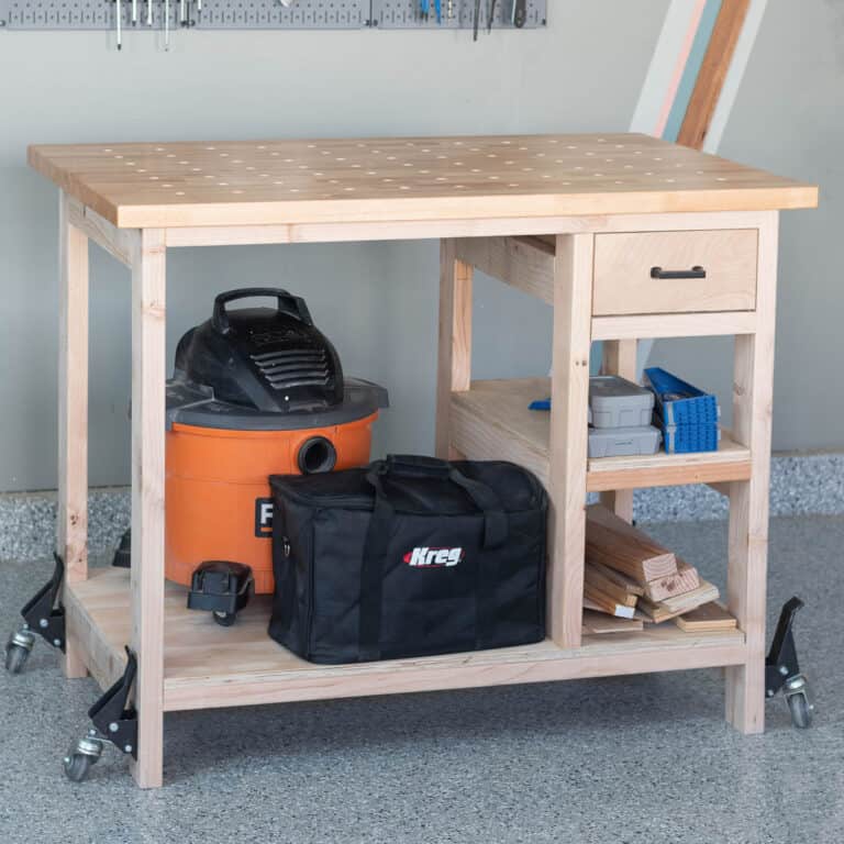 Need a small workbench for your workshop but want storage as well? Here is how to build a simple DIY small mobile workbench with shelves and a drawer.