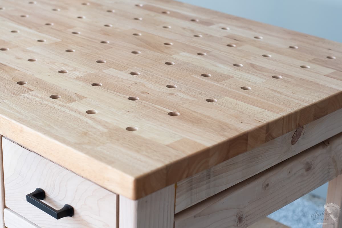 close up of the workbench top with dog holes