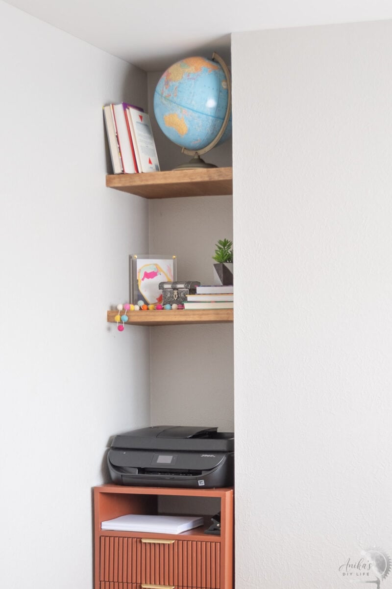 View of the entire nook with diy floating shelves.
