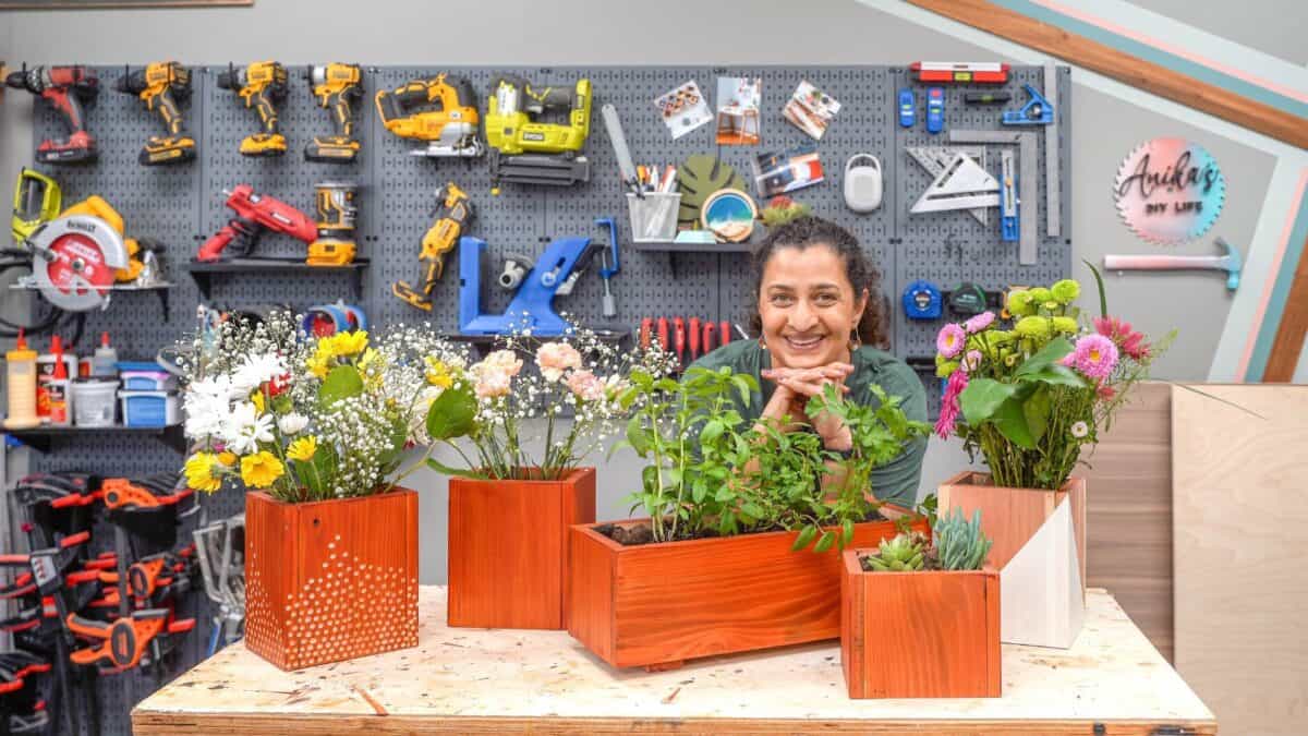 Anika with DIY wood vases and planters