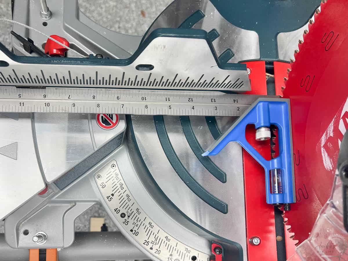 checking the miter saw alignment of the blade with the fence