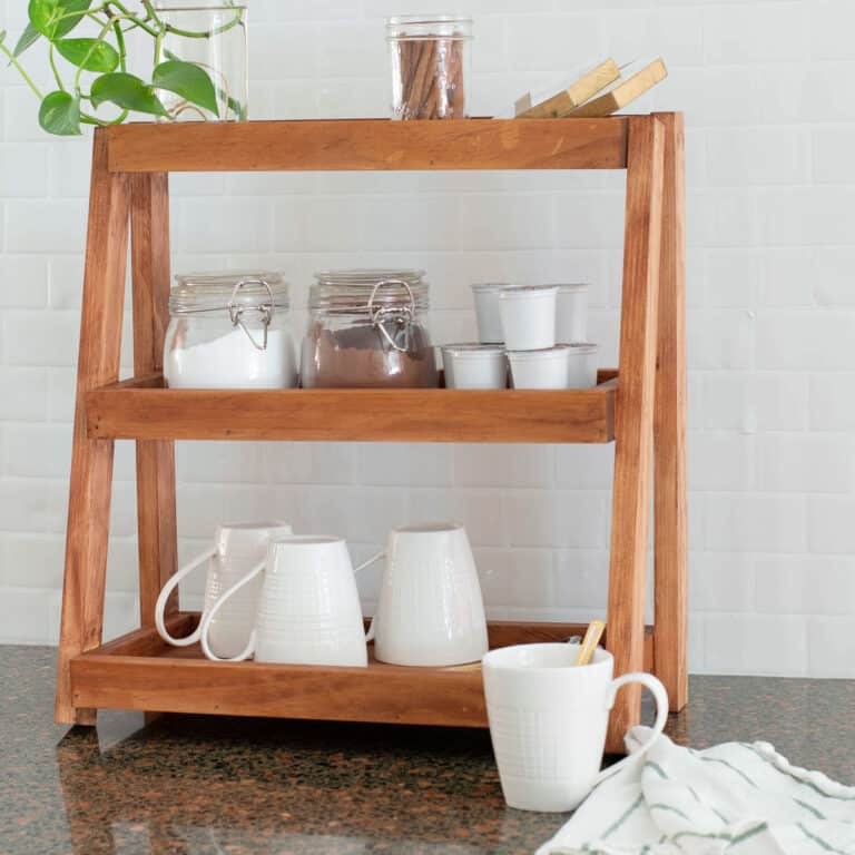 Learn how to build a versatile wooden DIY tiered organizer with this step-by-step tutorial and build plans. It is perfect for the kitchen, bathroom, or office.
