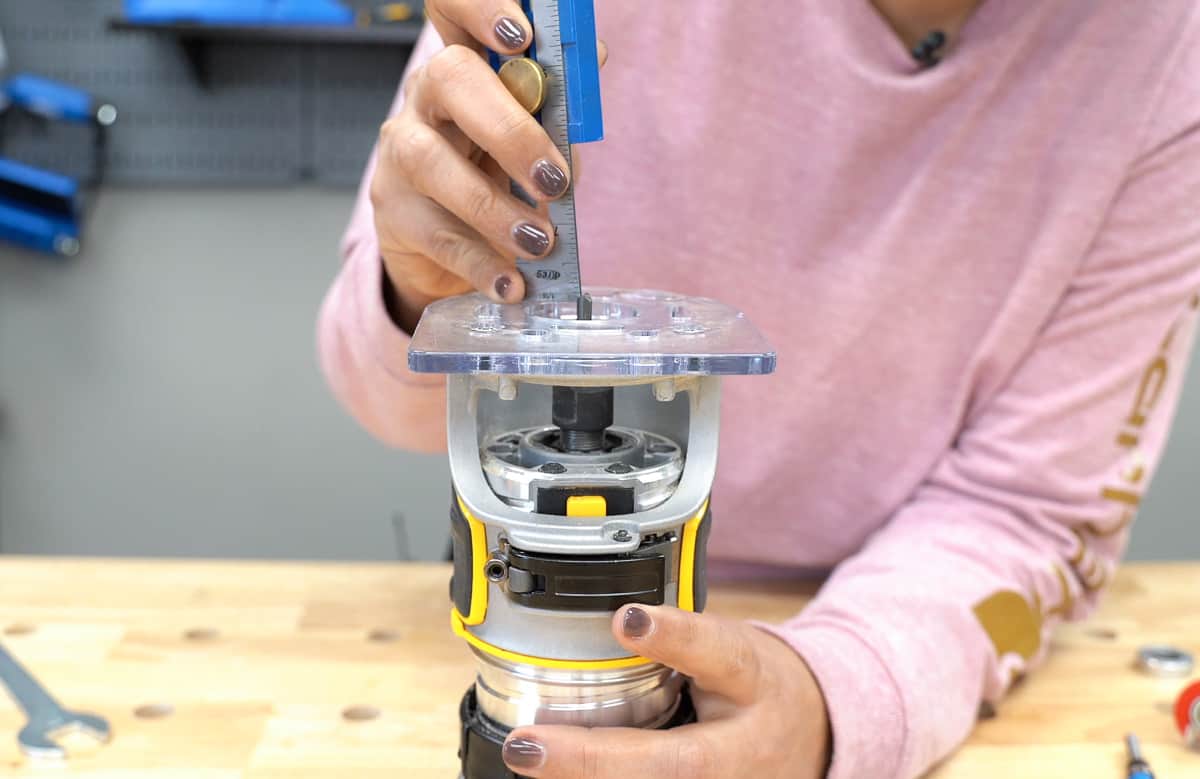 checking the height of the router bit and adjusting the router depth