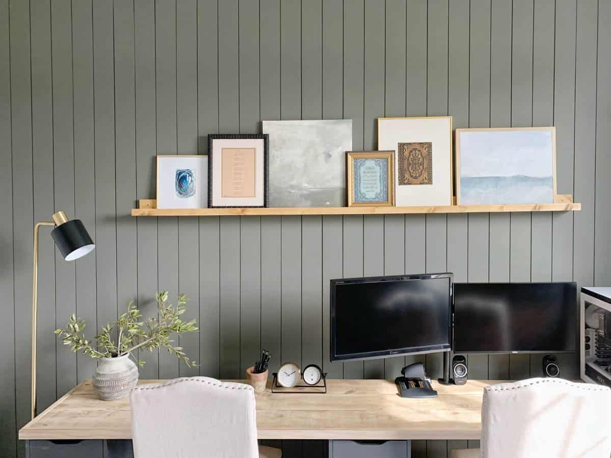 Art ledge shelf on the wall above a desk