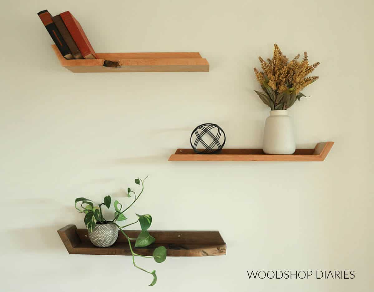 set of three modern floating wall shelves on the wall with decor