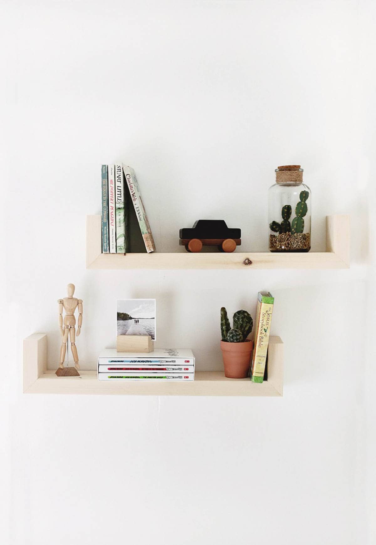 natural finished wood wall shelves with decor
