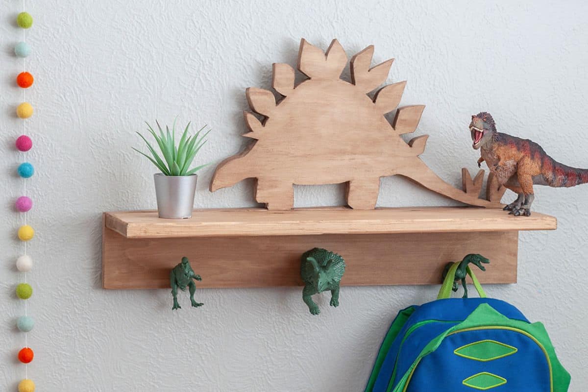 DIY dinosaur shelf hanging on the wall