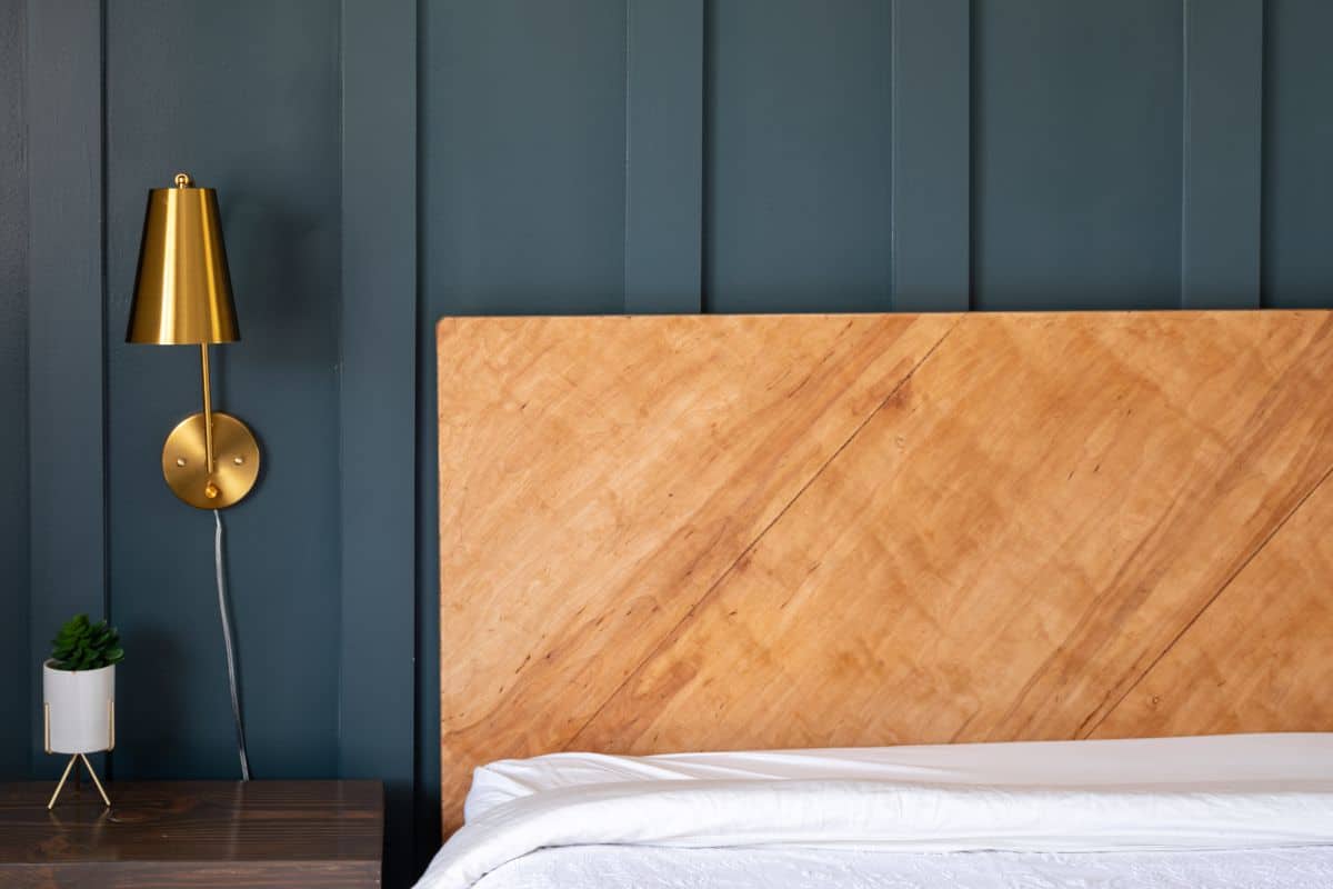 Maple plywood headboard in room with white bedding