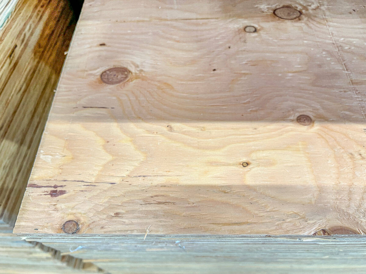 Structural plywood with defects and knots
