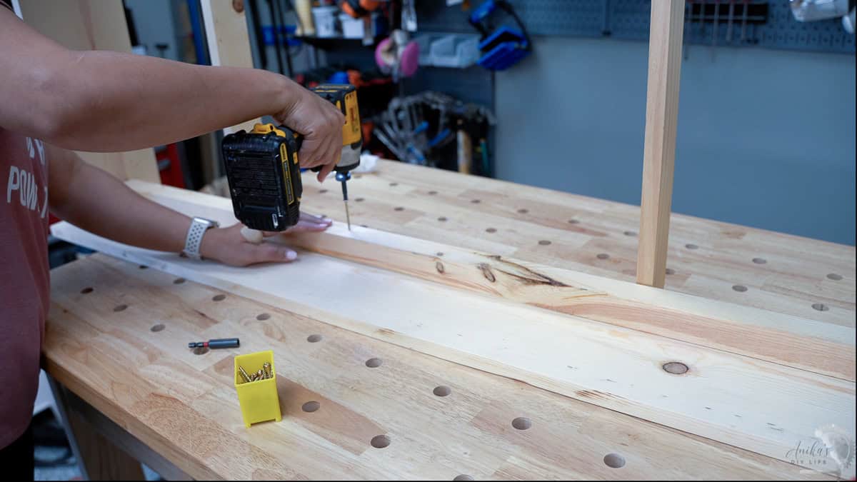 attaching the 2x2 support for the slats for the diy trundle bed