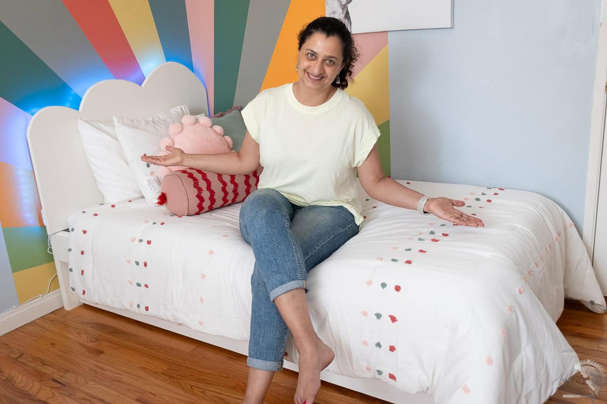 Anika on a diy twin bed in girls room