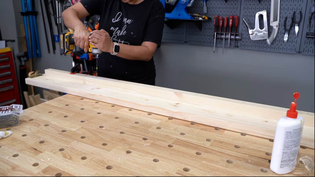 attaching the 2x2 board to the rails using screws