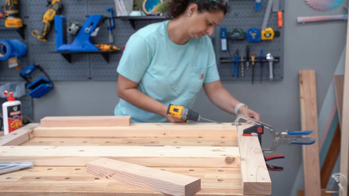 Anika building the headboard for the twin bed