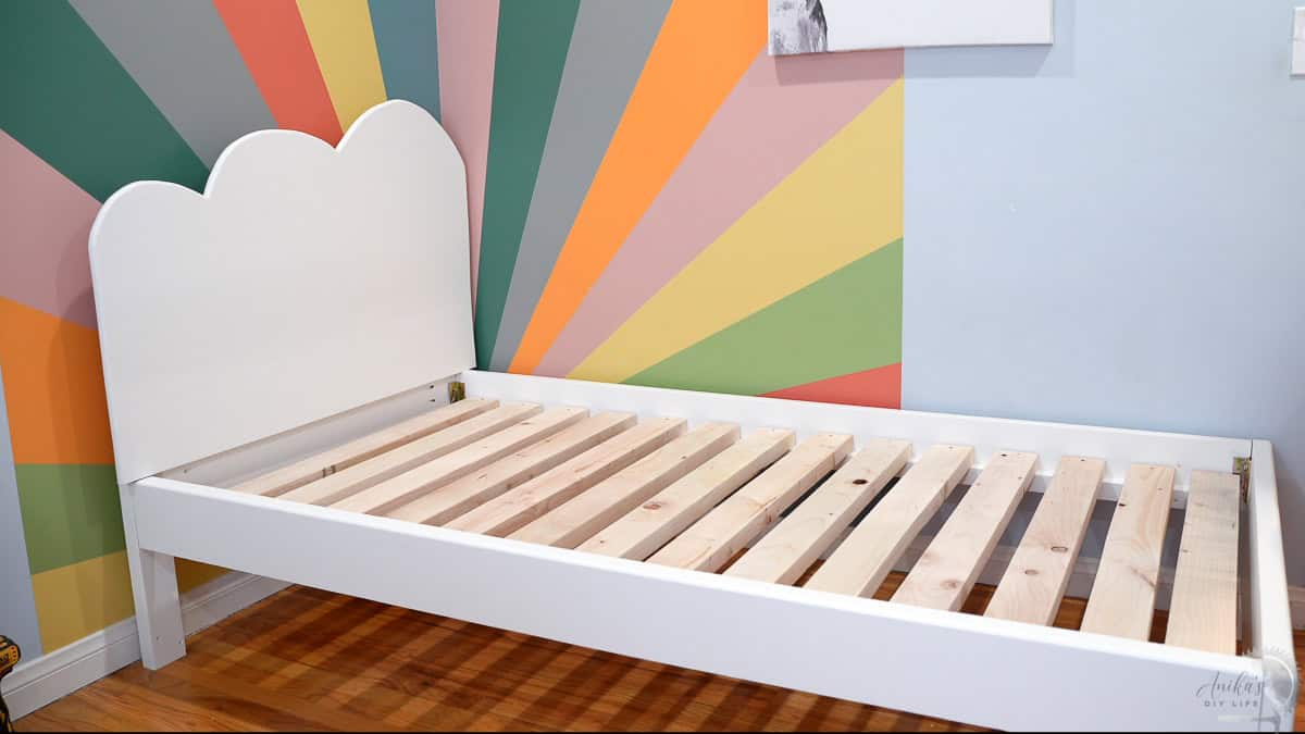 DIY Twin bed without bedding in colorful room