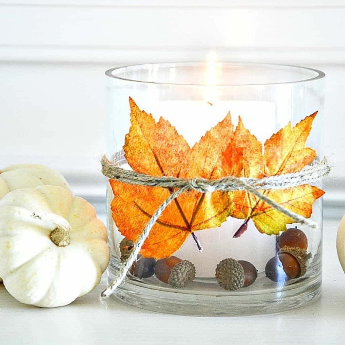 glass candle holder with leaves and acorns