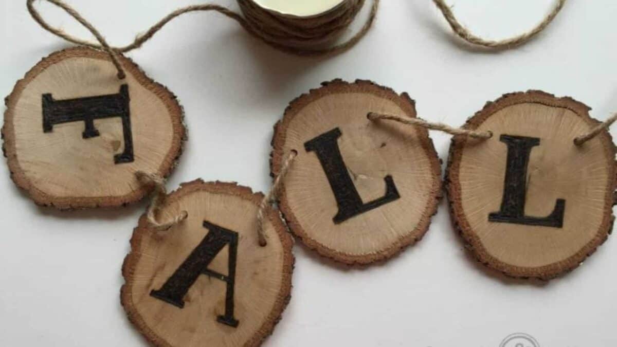 "Fall" banner made from wood slices