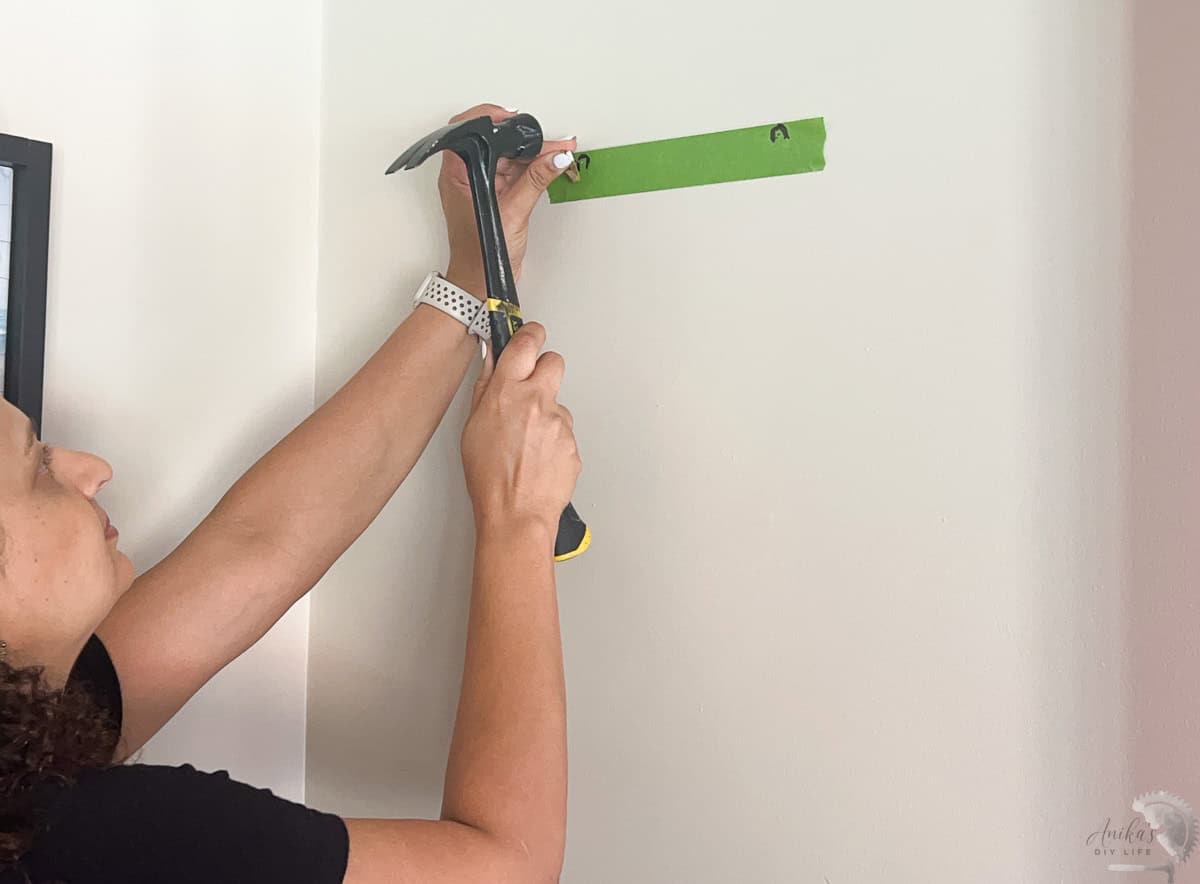 Adding wall hangers to hang up the artwork
