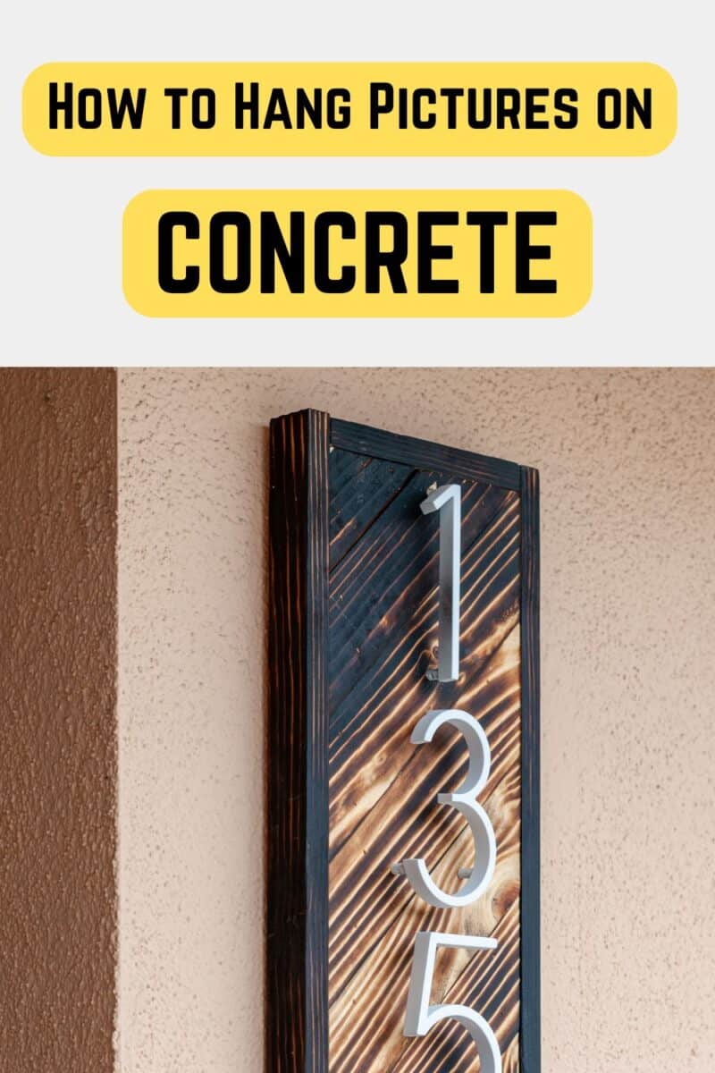 house number sign hung on concrete
