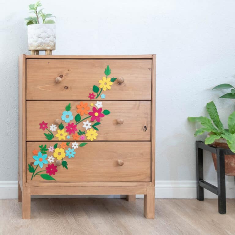 Learn how to transform a basic Ikea Rast dresser into a stylish statement piece with custom Cricut wood cutouts and colorful paint. Easy DIY tutorial for beginners!