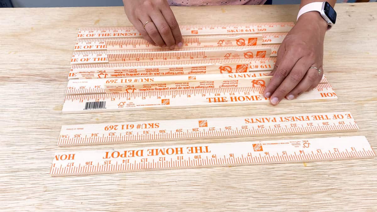 Arranging yardsticks for DIY lighted pumpkin