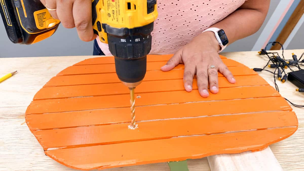 Drilling holes in pumpkin to add LED lights