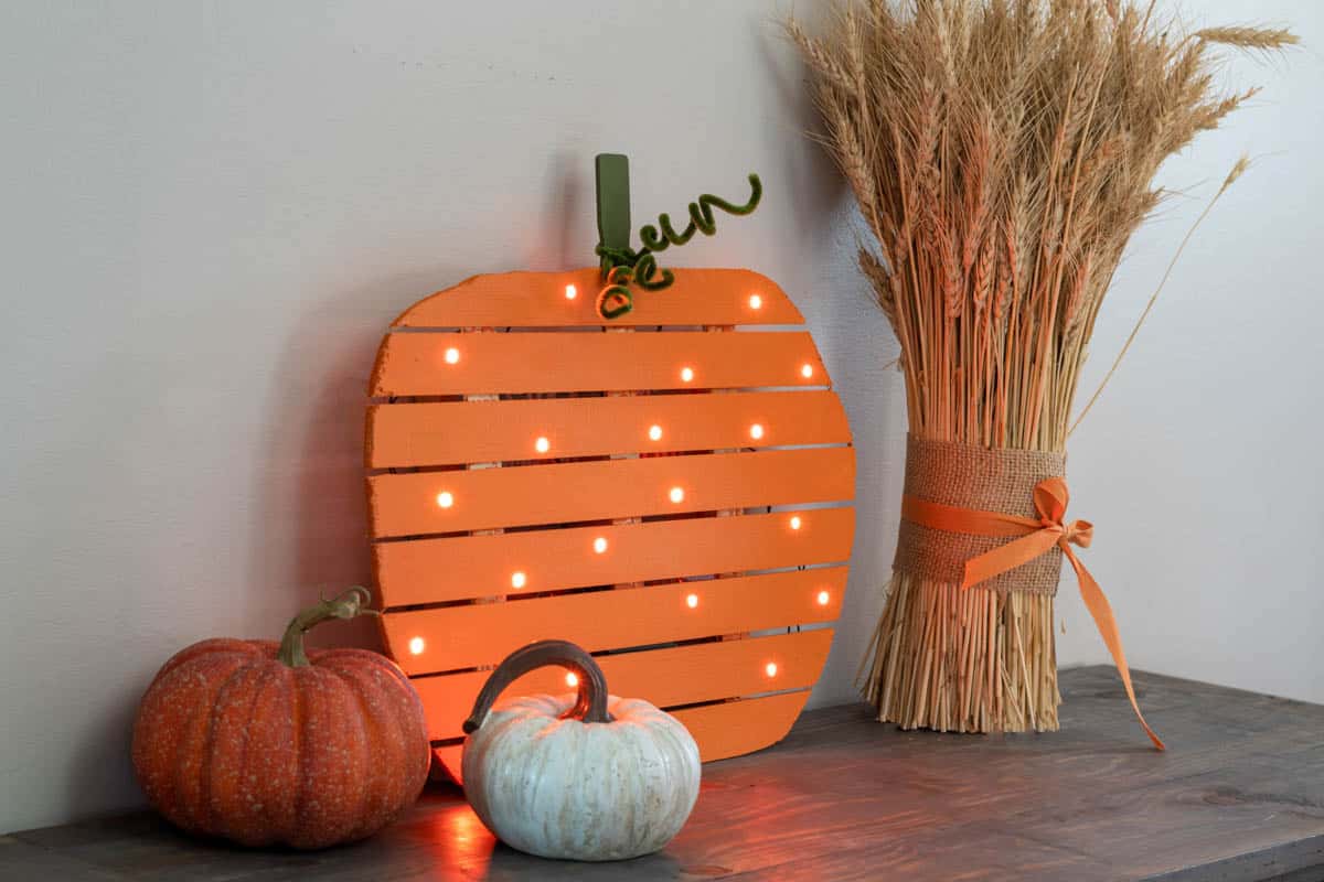 DIY lighted pumpkin made with paint sticks