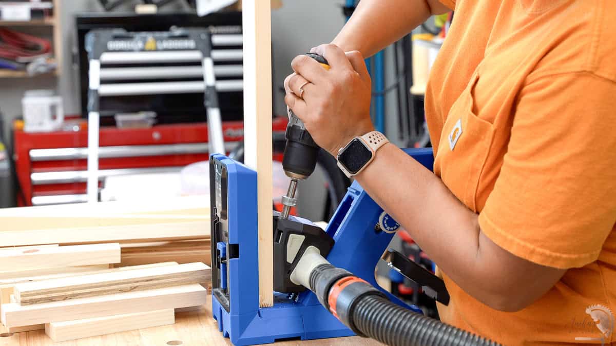 Woman making pocket holes using the Kreg 720.