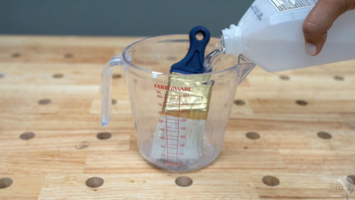 cleaning a dried paint brush using rubbing alcohol