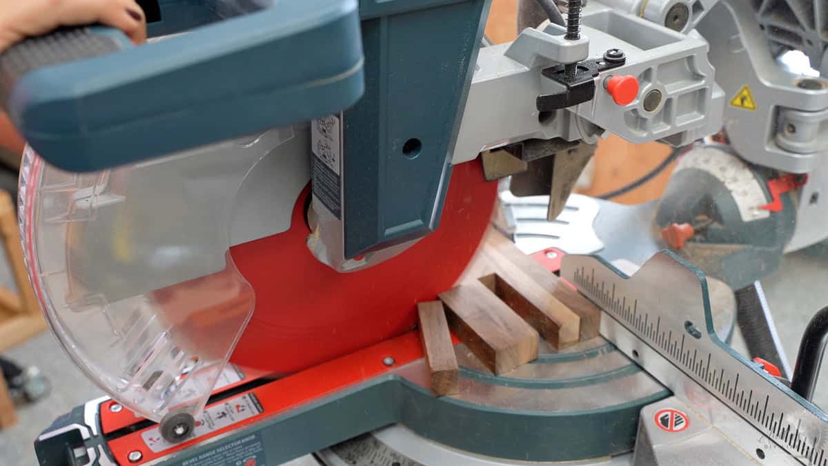trimming the excess strips off on the miter saw