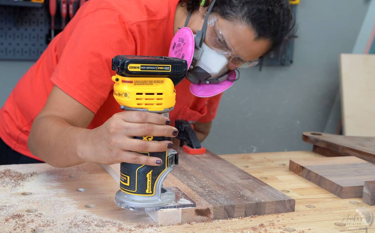 Using a router to route out the chamfer on the edge of the cutting board