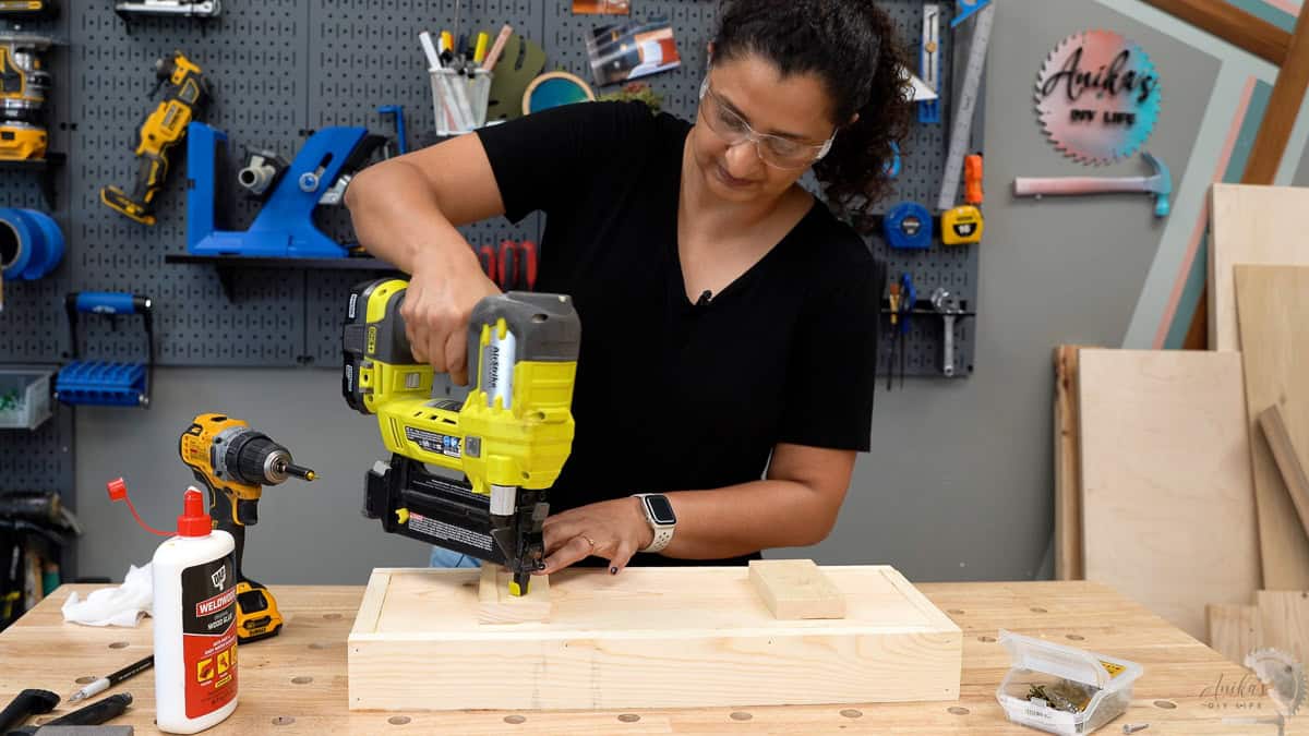 Attaching the feet at the bottom using finish nails