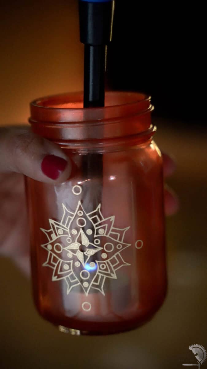 lighting the tealight inside the diwali lantern