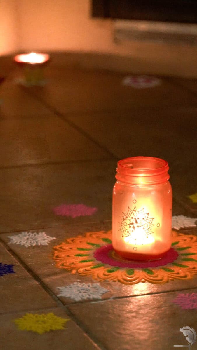 DIY diwali lantern on door step with colorful rangoli