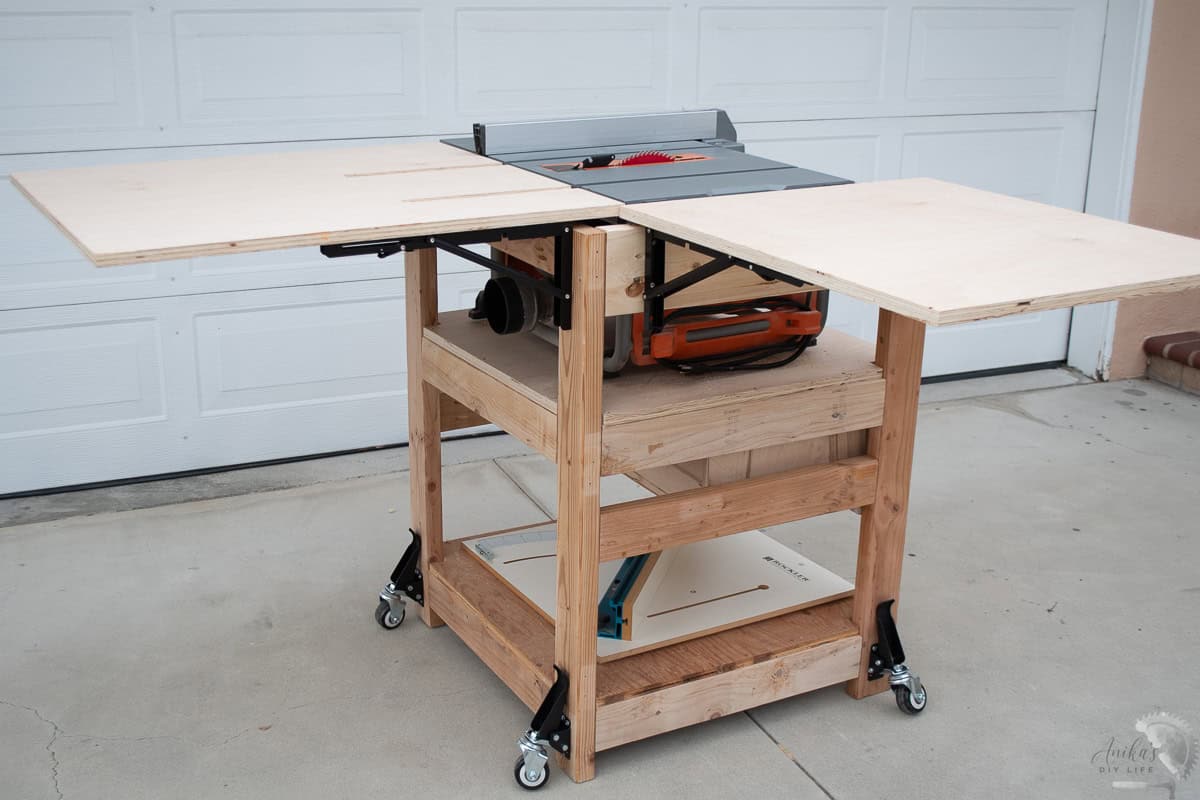 DIY table saw stand with open outfeed table and extension wing
