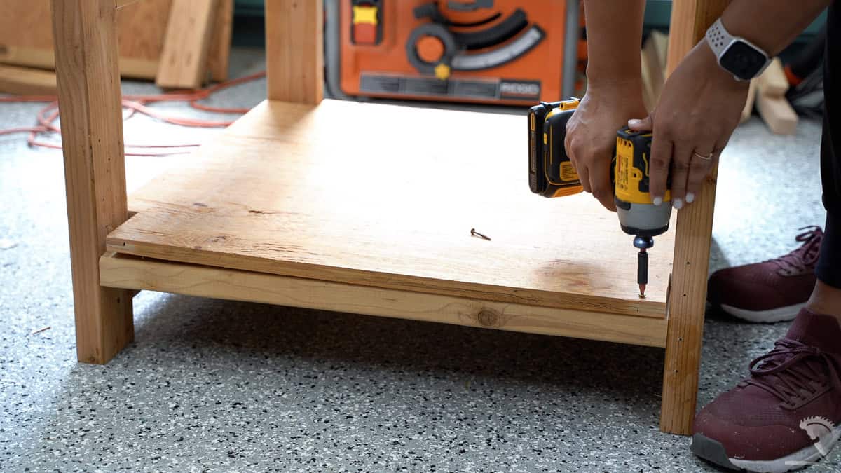 attaching the bottom shelf using screws