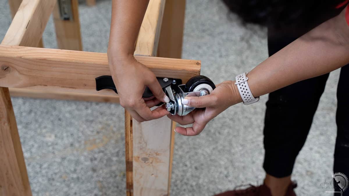 Attaching casters to the table stand