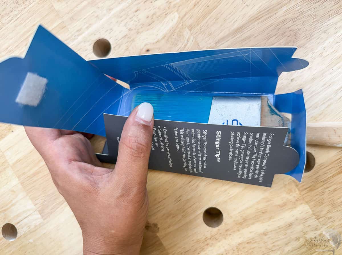 wrapping a paintbrush in its packaging